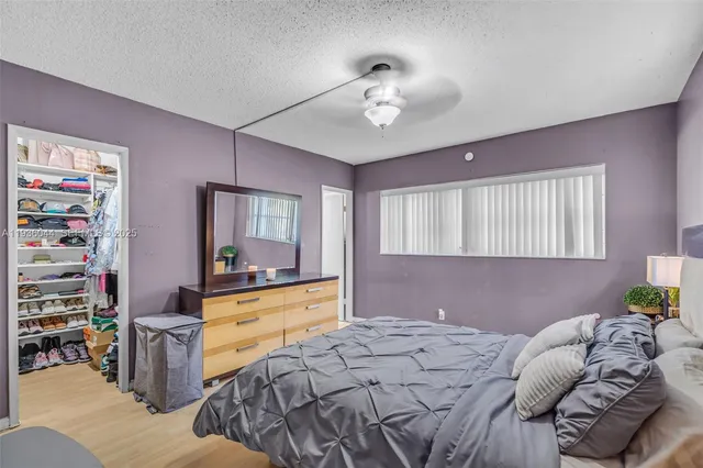 a bed room with a bed and a television