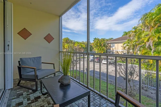 a view of a balcony with chairs
