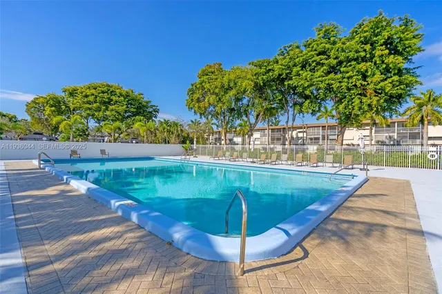 a view of a swimming pool with a patio