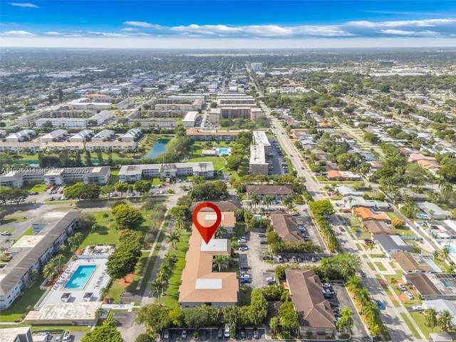 an aerial view of residential building and lake