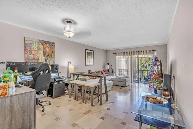a view of a livingroom with furniture and a window