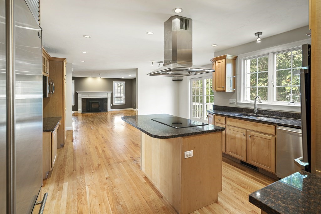 33 Bridge Street Needham, MA 02494 - Photo 4 of 19 a kitchen with stainless steel appliances granite countertop a sink a stove and a wooden floors