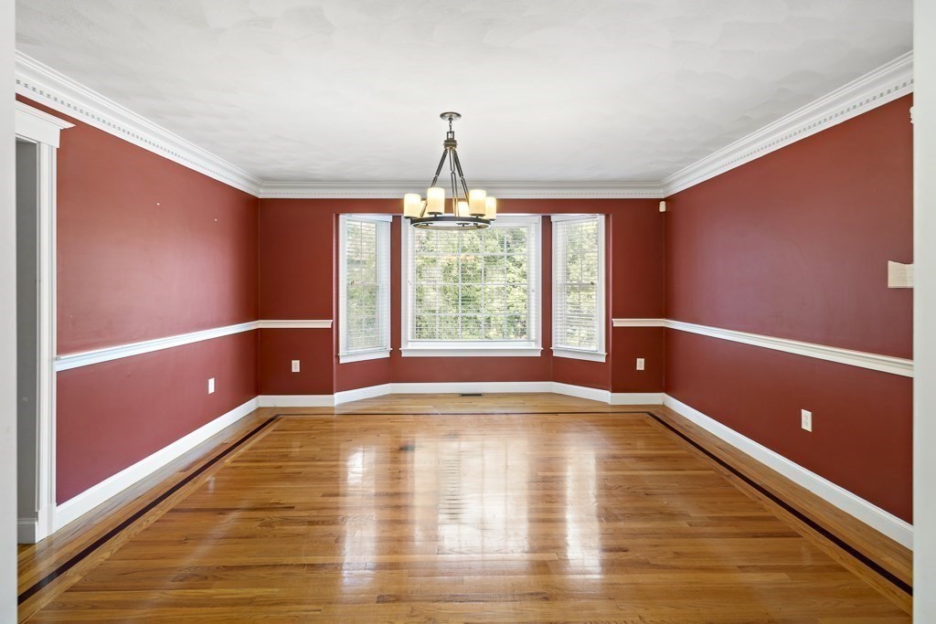 33 Bridge Street Needham, MA 02494 - Photo 6 of 19 a view of an empty room with window chandelier