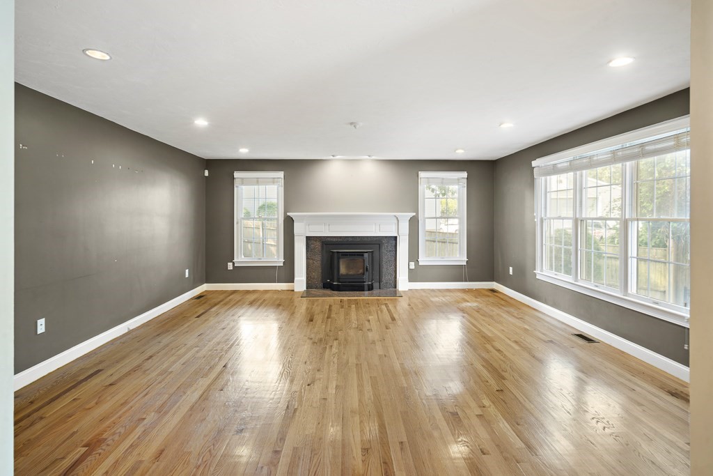 33 Bridge Street Needham, MA 02494 - Photo 8 of 19 a view of an empty room with wooden floor and a window
