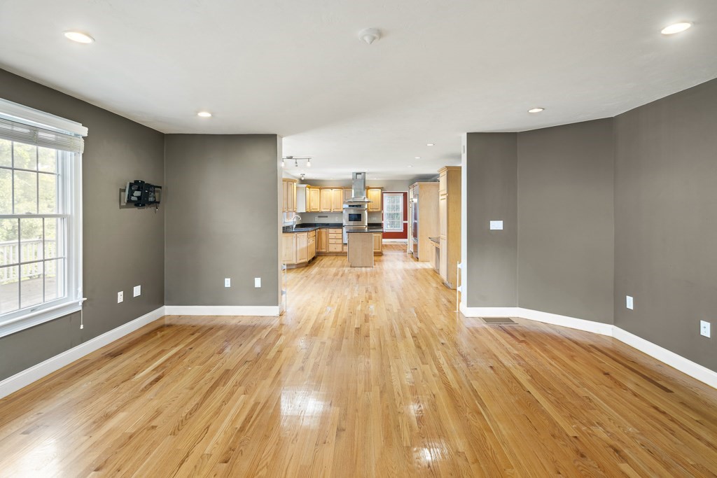 33 Bridge Street Needham, MA 02494 - Photo 9 of 19 a view of a room with wooden floor and furniture