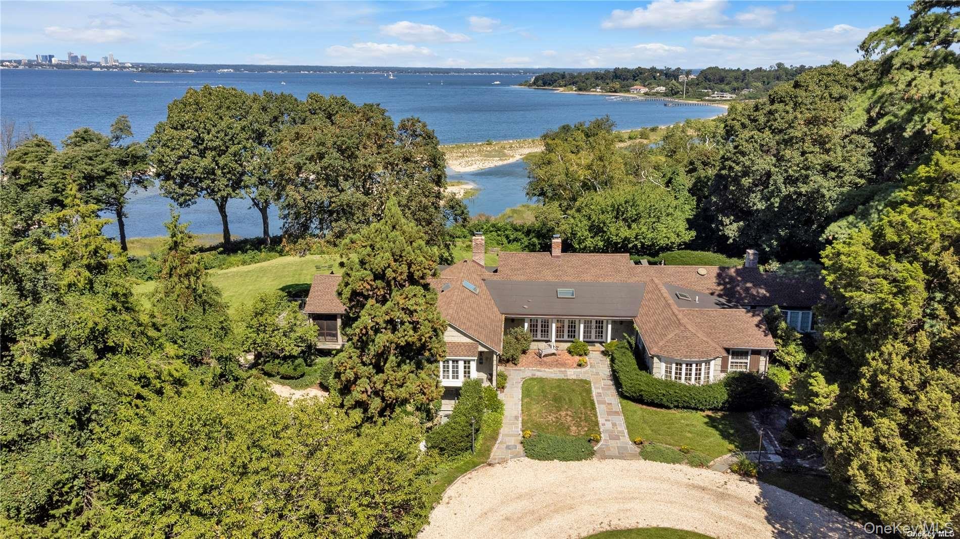 an aerial view of a house with a lake view