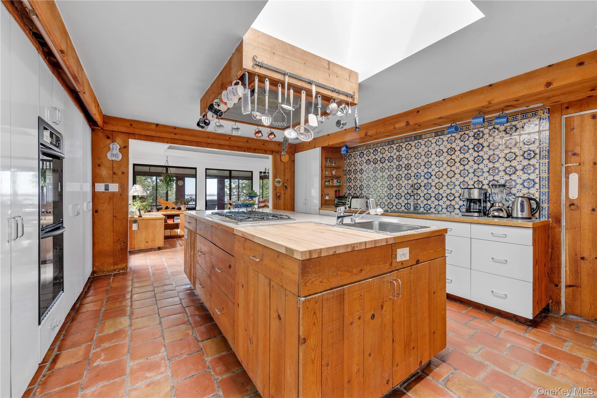 120 West Creek Farms Road Sands Point, NY 11050 - Photo 13 of 36 a open kitchen with stainless steel appliances granite countertop a stove and cabinets
