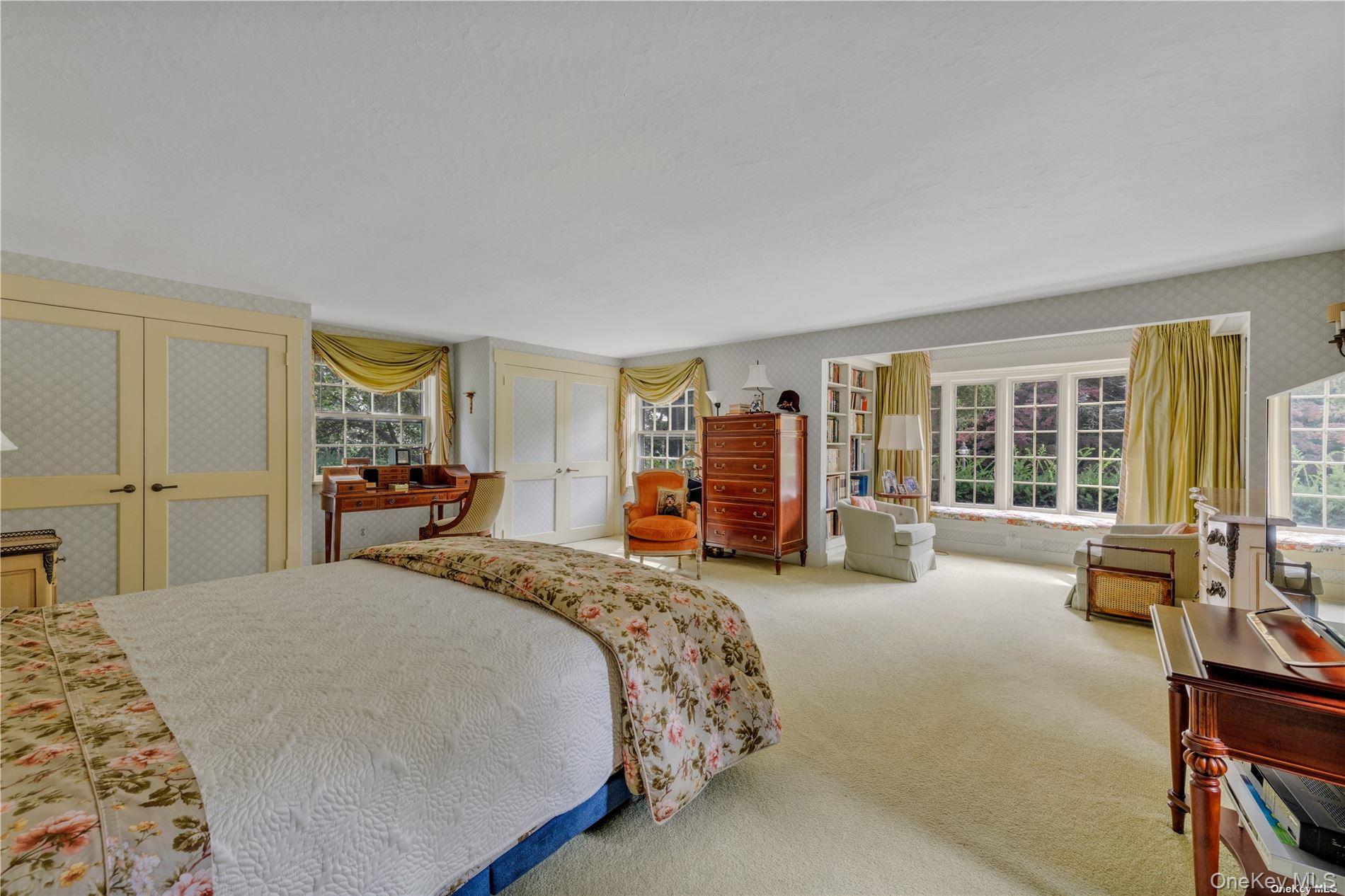 120 West Creek Farms Road Sands Point, NY 11050 - Photo 16 of 36 a bed room with a bed and a couch