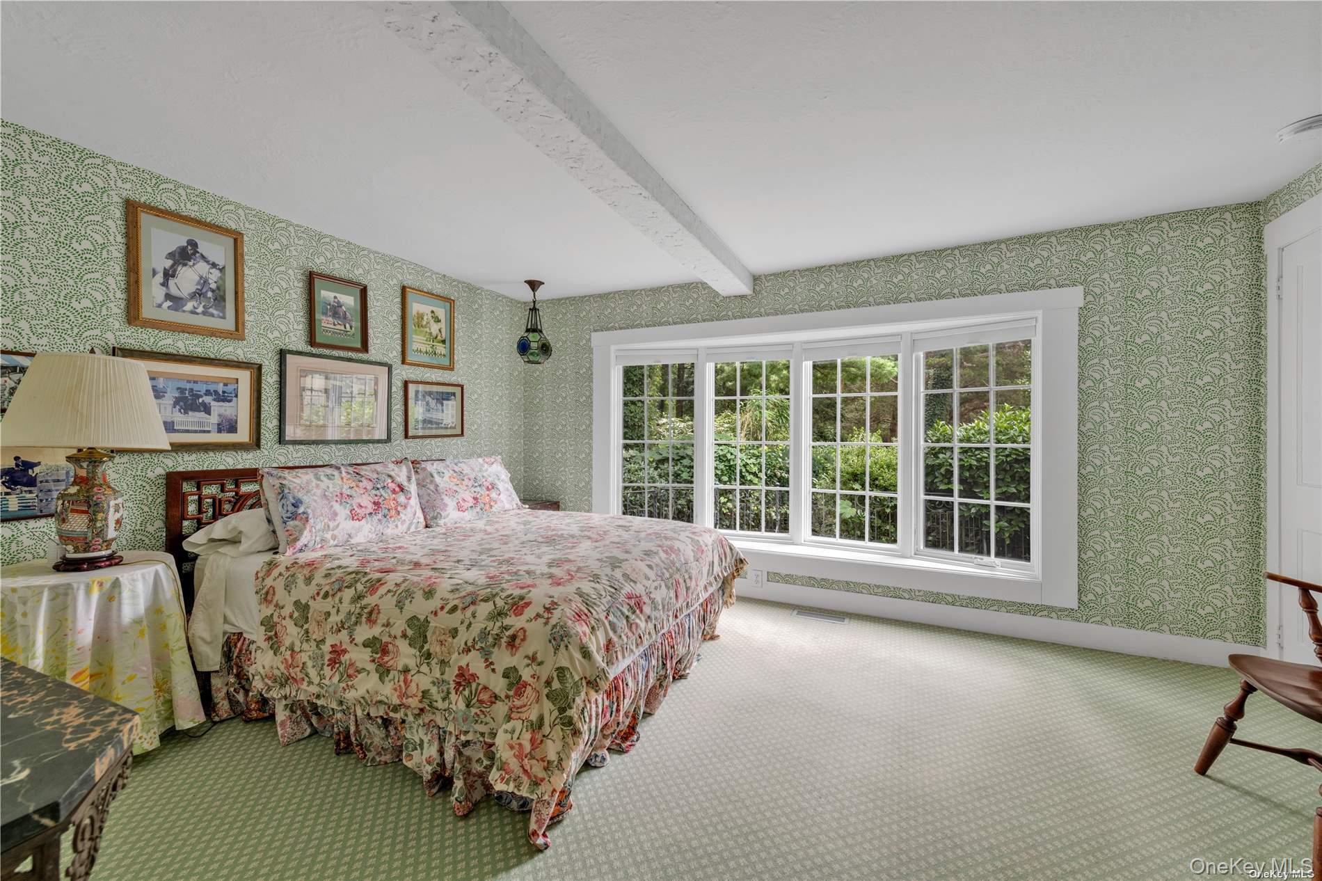 120 West Creek Farms Road Sands Point, NY 11050 - Photo 18 of 36 a bedroom with a large bed and a window