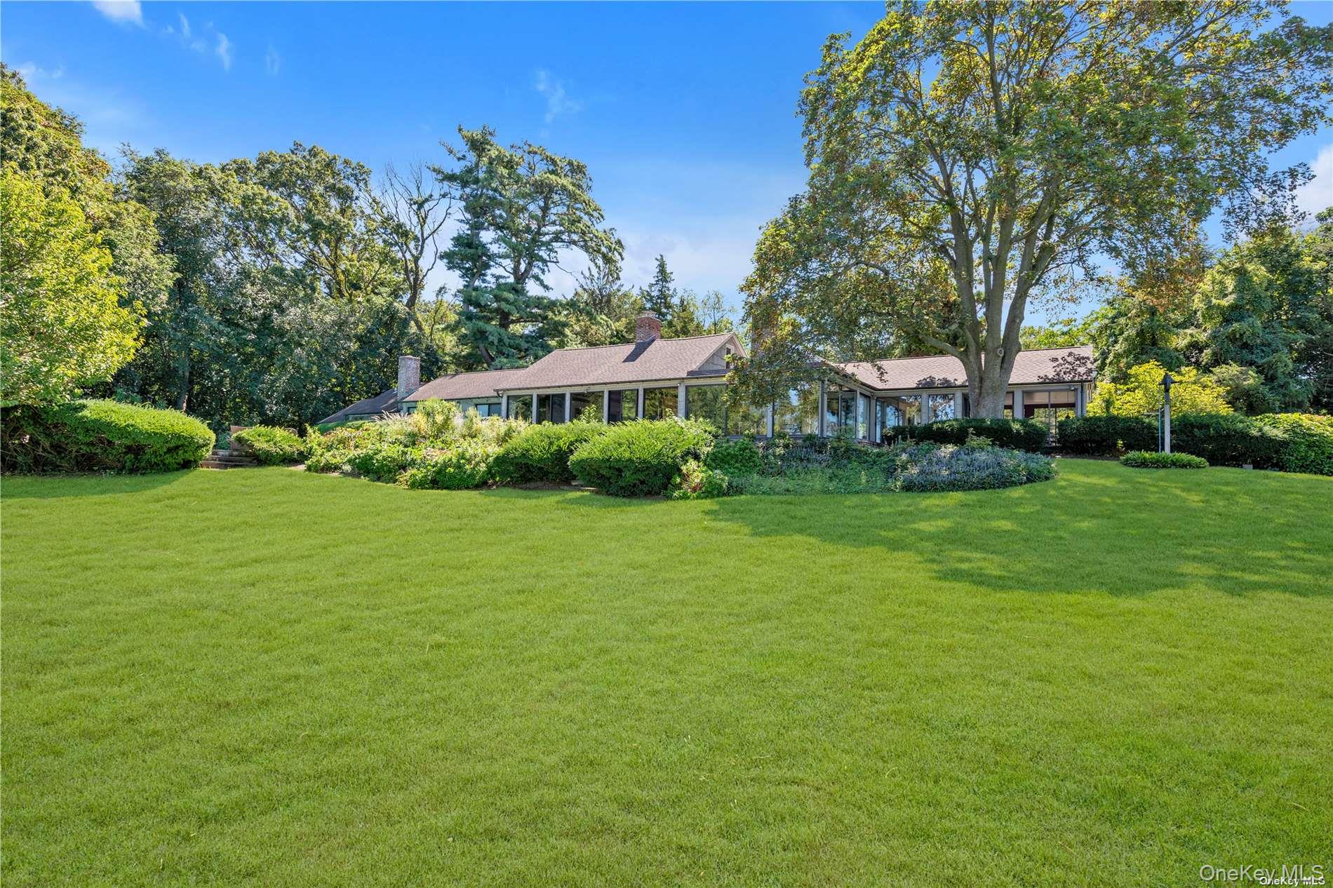 120 West Creek Farms Road Sands Point, NY 11050 - Photo 19 of 36 a view of a house with a big yard