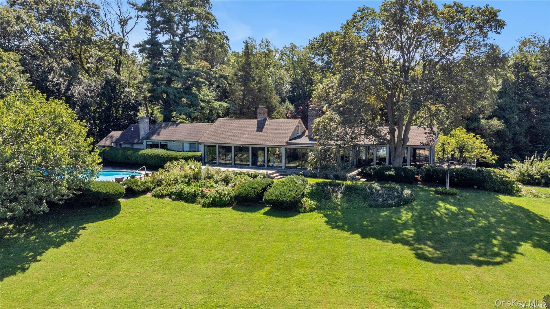 120 West Creek Farms Road Sands Point, NY 11050 - Photo 20 of 36 a aerial view of a house with swimming pool and green space