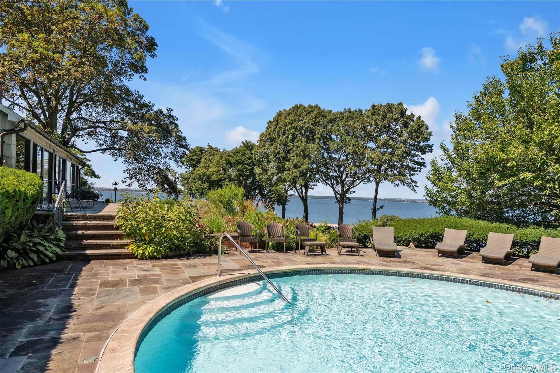 120 West Creek Farms Road Sands Point, NY 11050 - Photo 22 of 36 a view of a patio with couches plants and large trees
