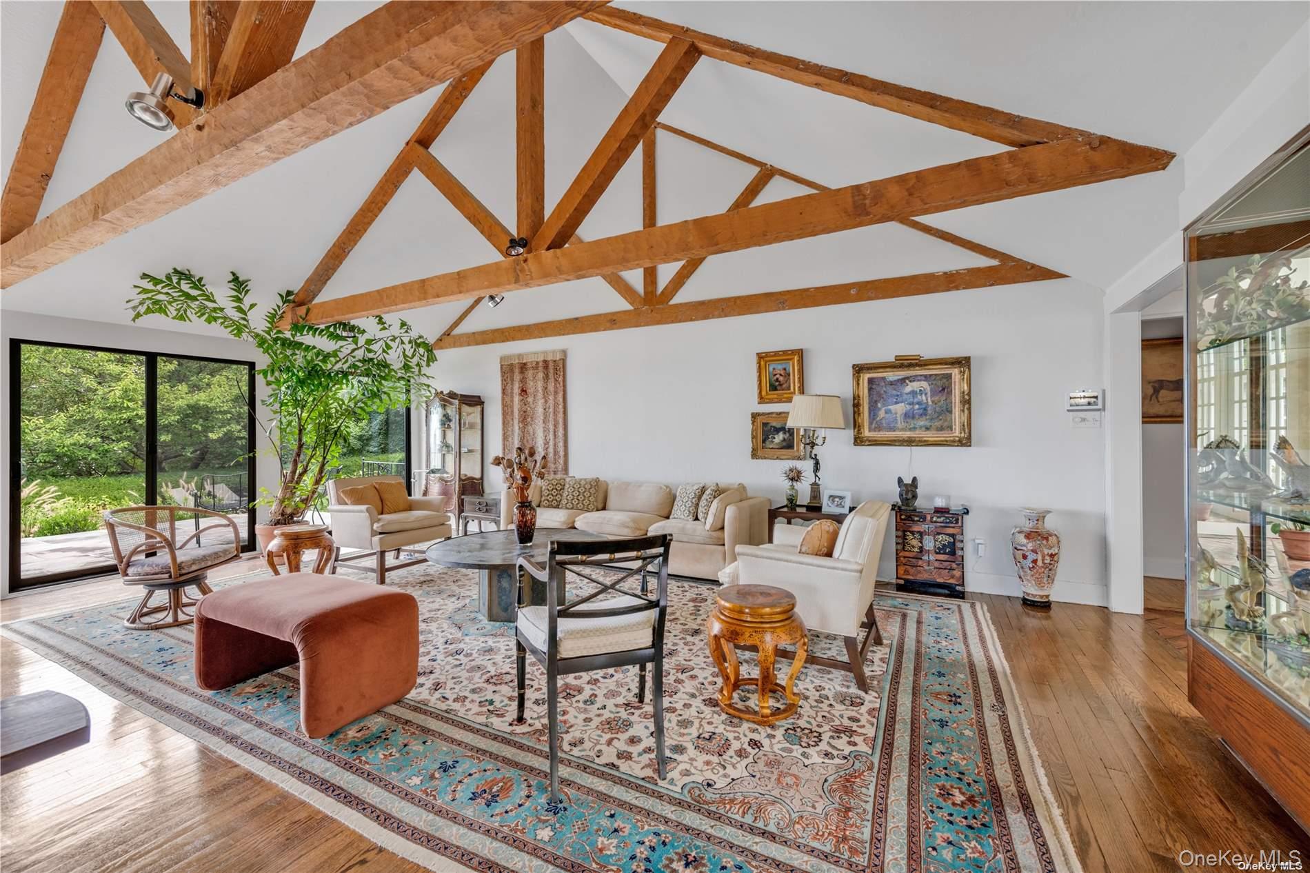 120 West Creek Farms Road Sands Point, NY 11050 - Photo 5 of 36 a living room with furniture a rug and a large window
