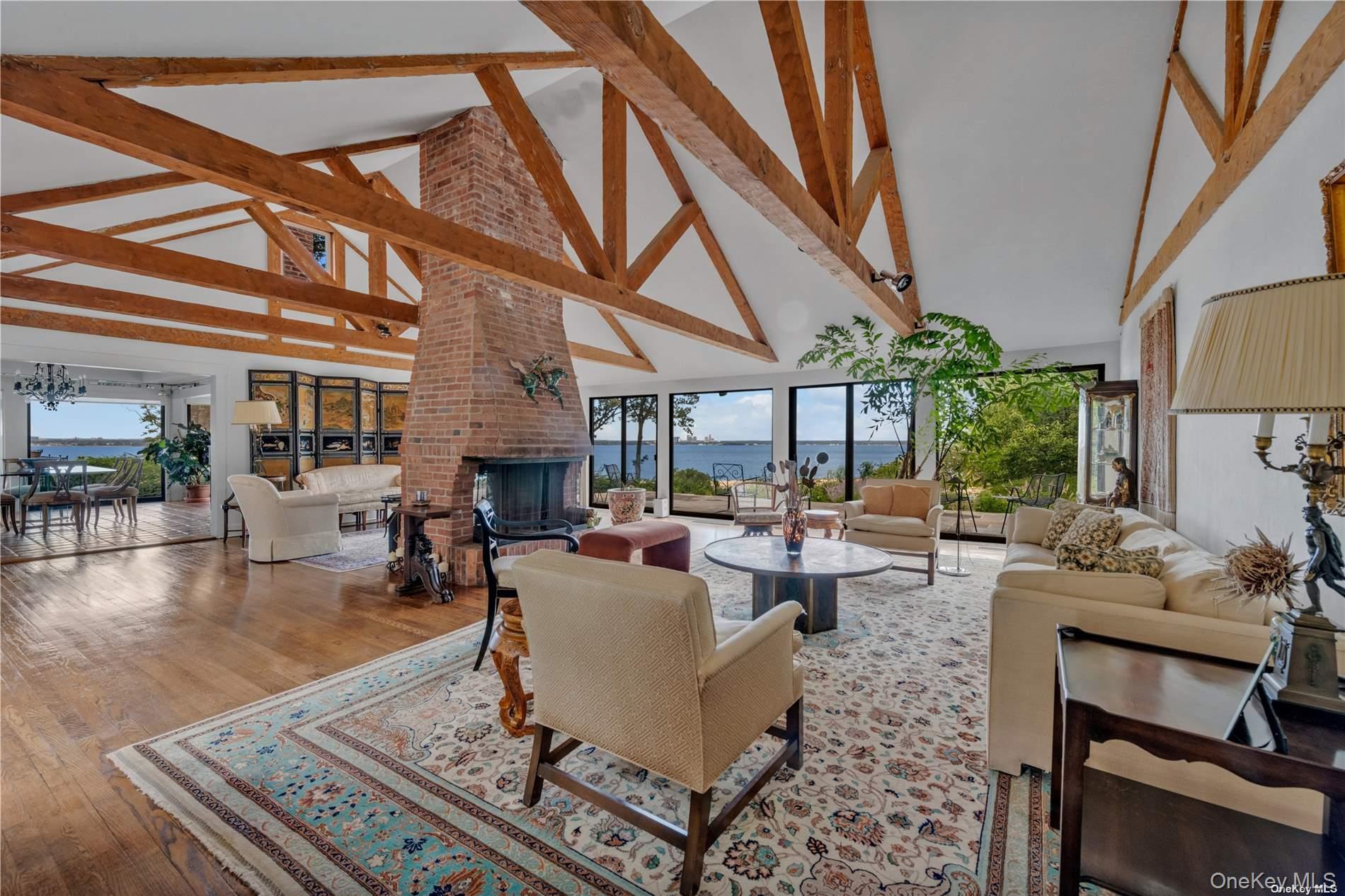 120 West Creek Farms Road Sands Point, NY 11050 - Photo 6 of 36 a living room with fireplace furniture and a large window