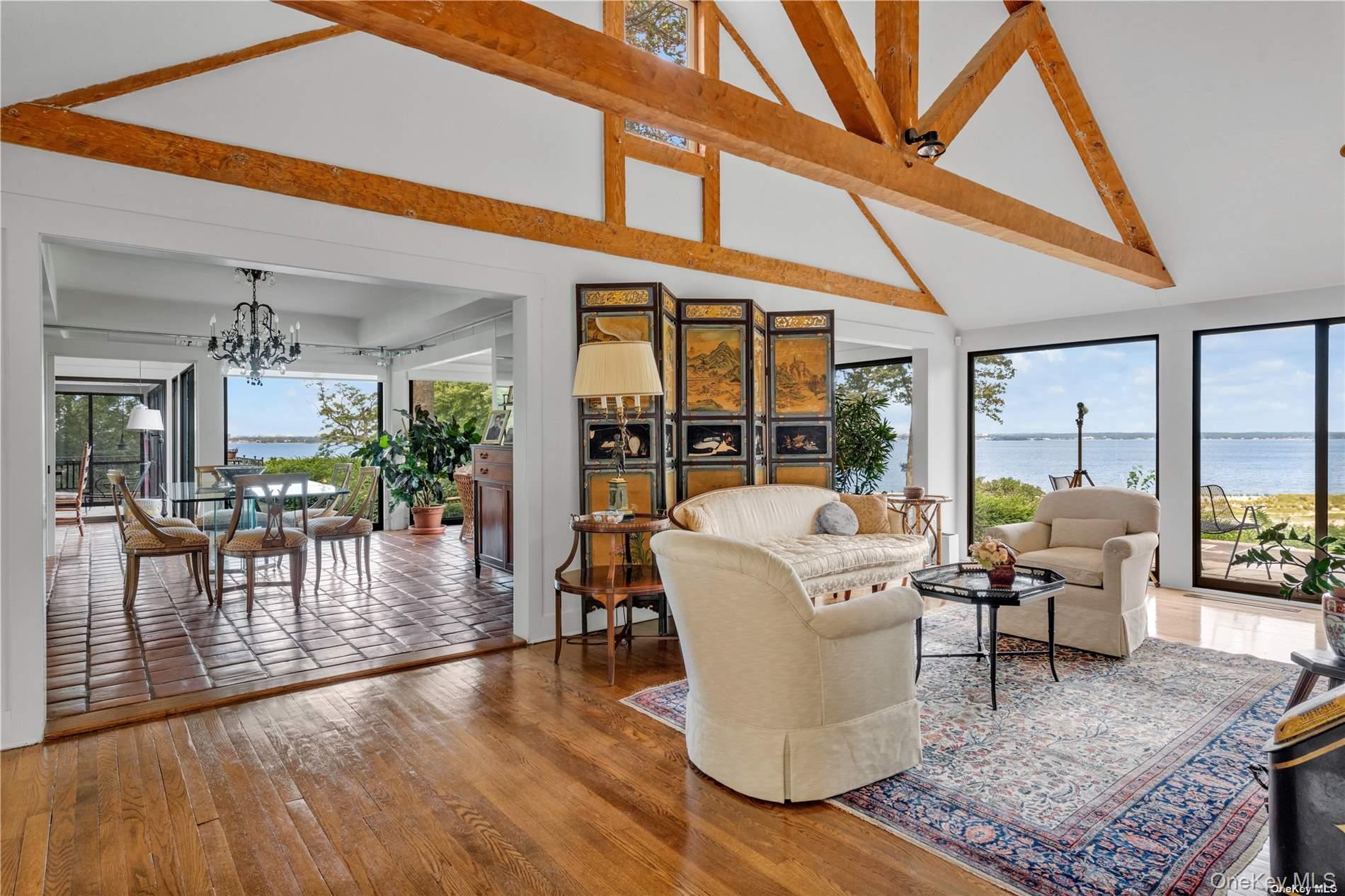 120 West Creek Farms Road Sands Point, NY 11050 - Photo 8 of 36 a living room with furniture and a floor to ceiling window