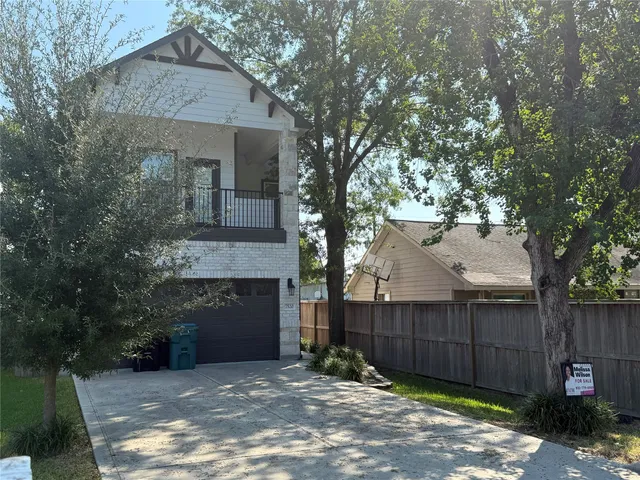 a front view of a house with a fence