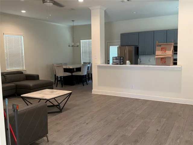 a living room with furniture and a table
