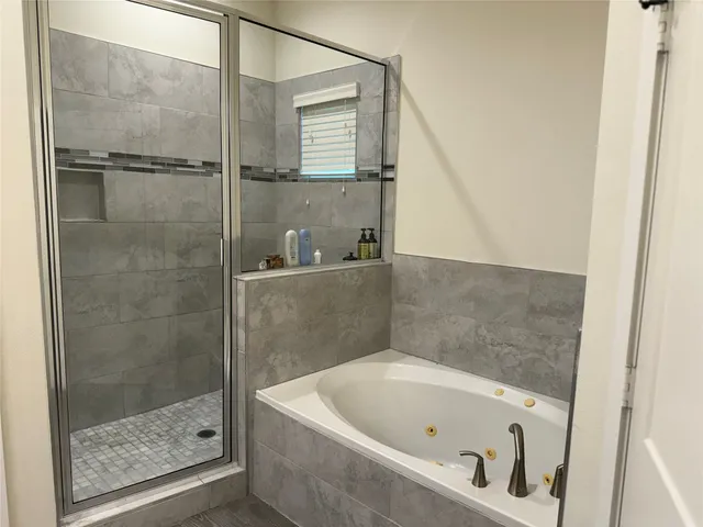 a bathroom with a double vanity sink and mirror