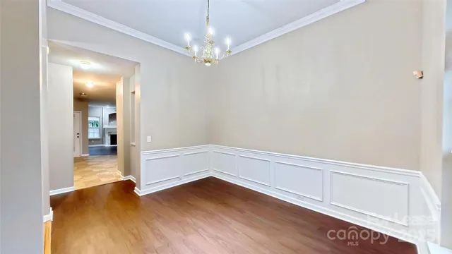 a view of livingroom with hallway and wooden floor