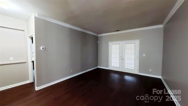 a view of room with hardwood floor