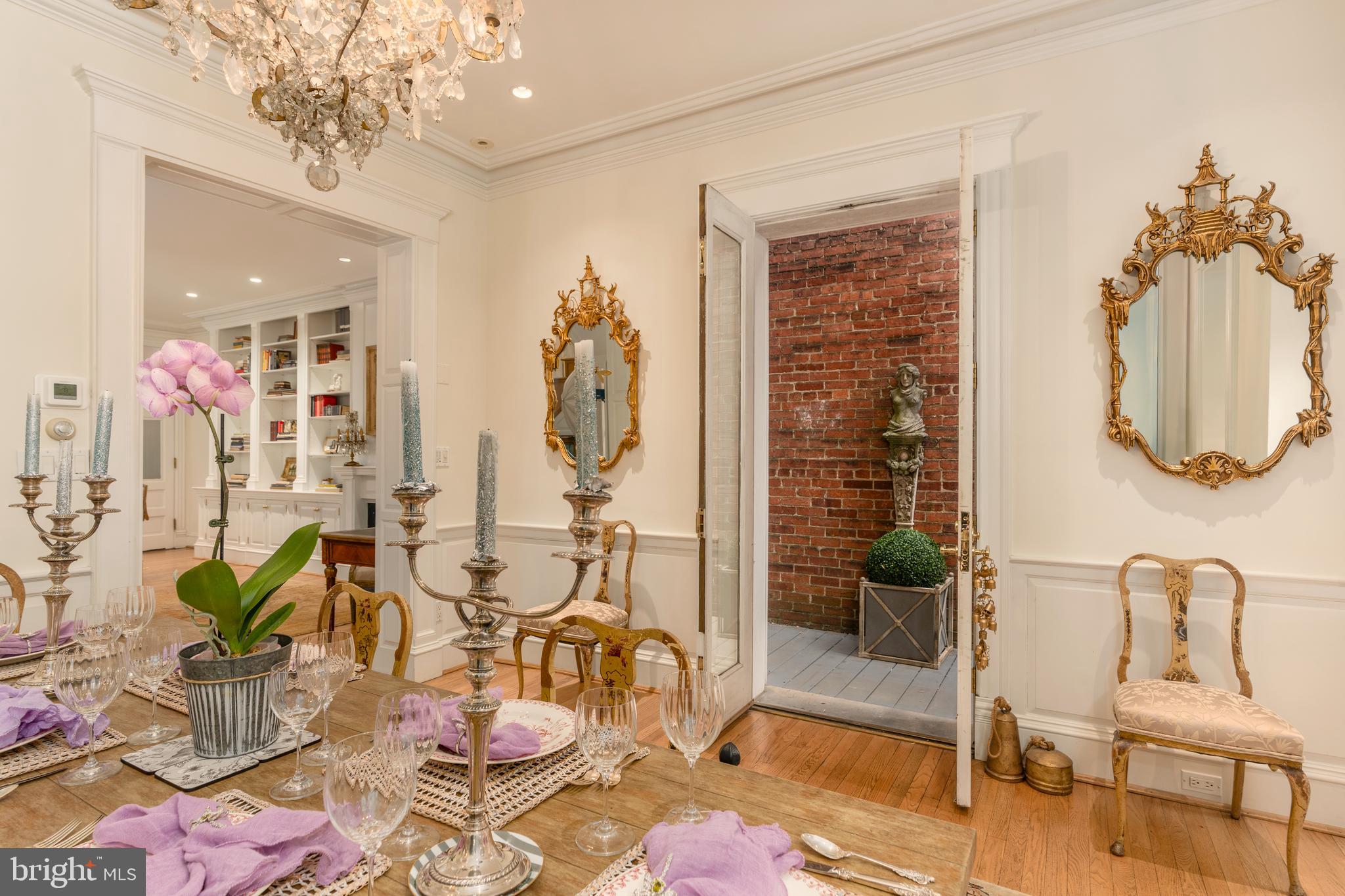 3070 Q Street Northwest Washington, DC 20007 - Photo 11 of 33 a view of a dining room with furniture and chandelier