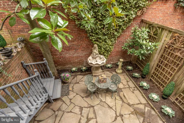 a vase of flowers sitting on a floor