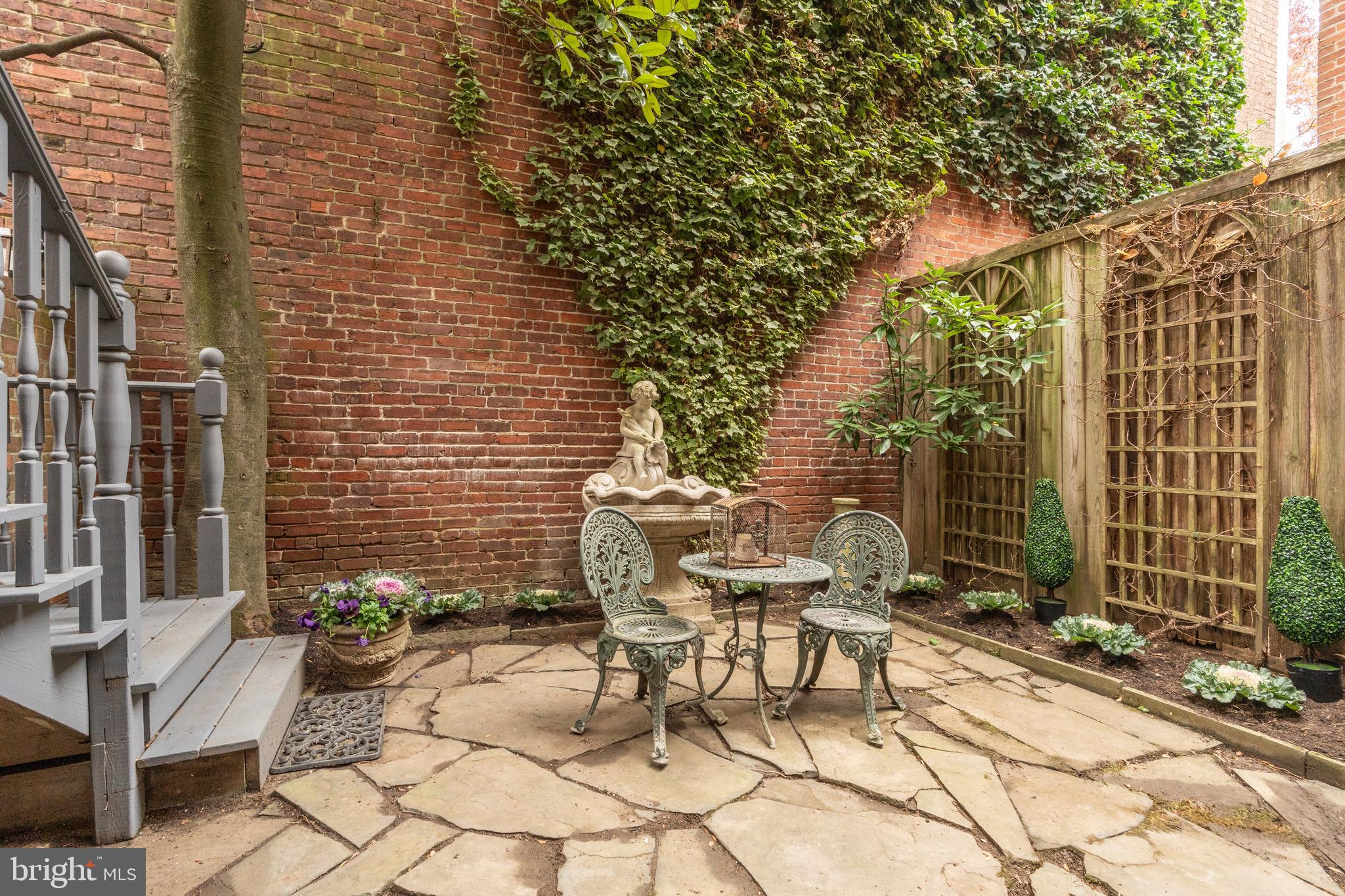 3070 Q Street Northwest Washington, DC 20007 - Photo 15 of 33 a view of a chairs and table in the backyard