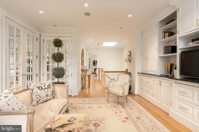 a kitchen with stainless steel appliances kitchen island granite countertop a refrigerator and cabinets