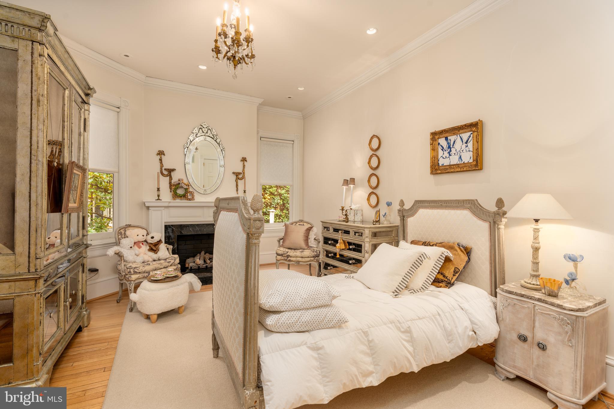 3070 Q Street Northwest Washington, DC 20007 - Photo 22 of 33 a living room with furniture a fireplace and a chandelier