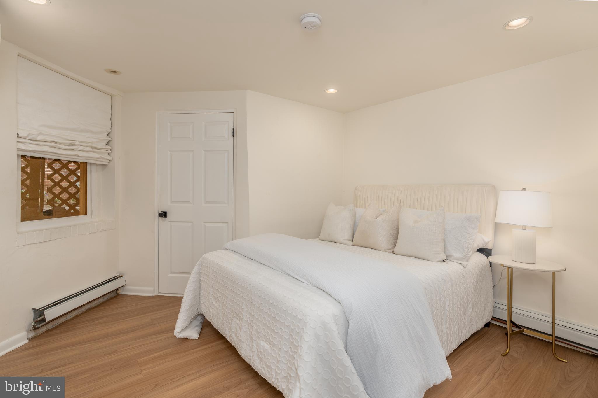 3070 Q Street Northwest Washington, DC 20007 - Photo 30 of 33 a bedroom with a bed and a night stand