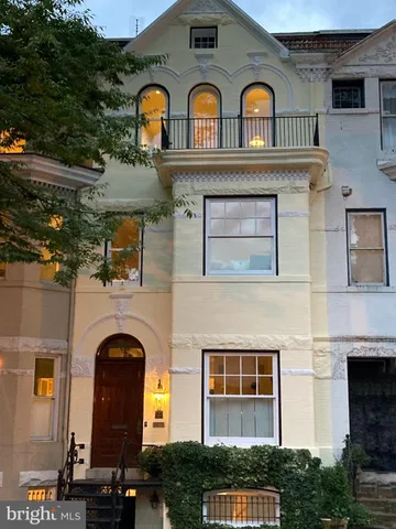 a front view of a house with glass windows