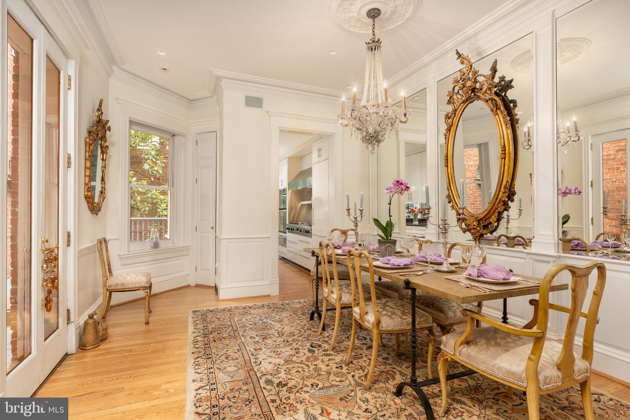 3070 Q Street Northwest Washington, DC 20007 - Photo 8 of 33 a view of a dining room with furniture and a chandelier