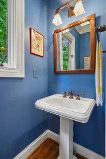 a bathroom with a toilet sink and tub