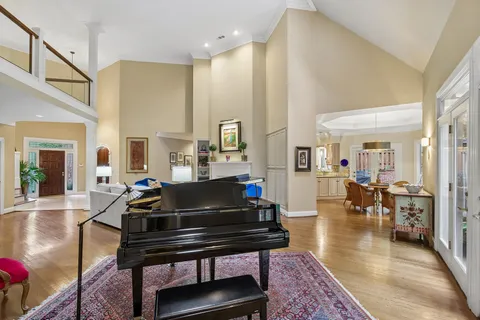 a view of a dining room with furniture wooden floor and chandelier