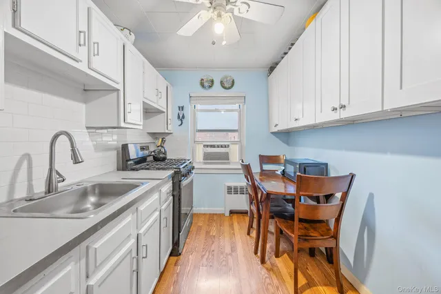 a kitchen with stainless steel appliances granite countertop a sink and cabinets