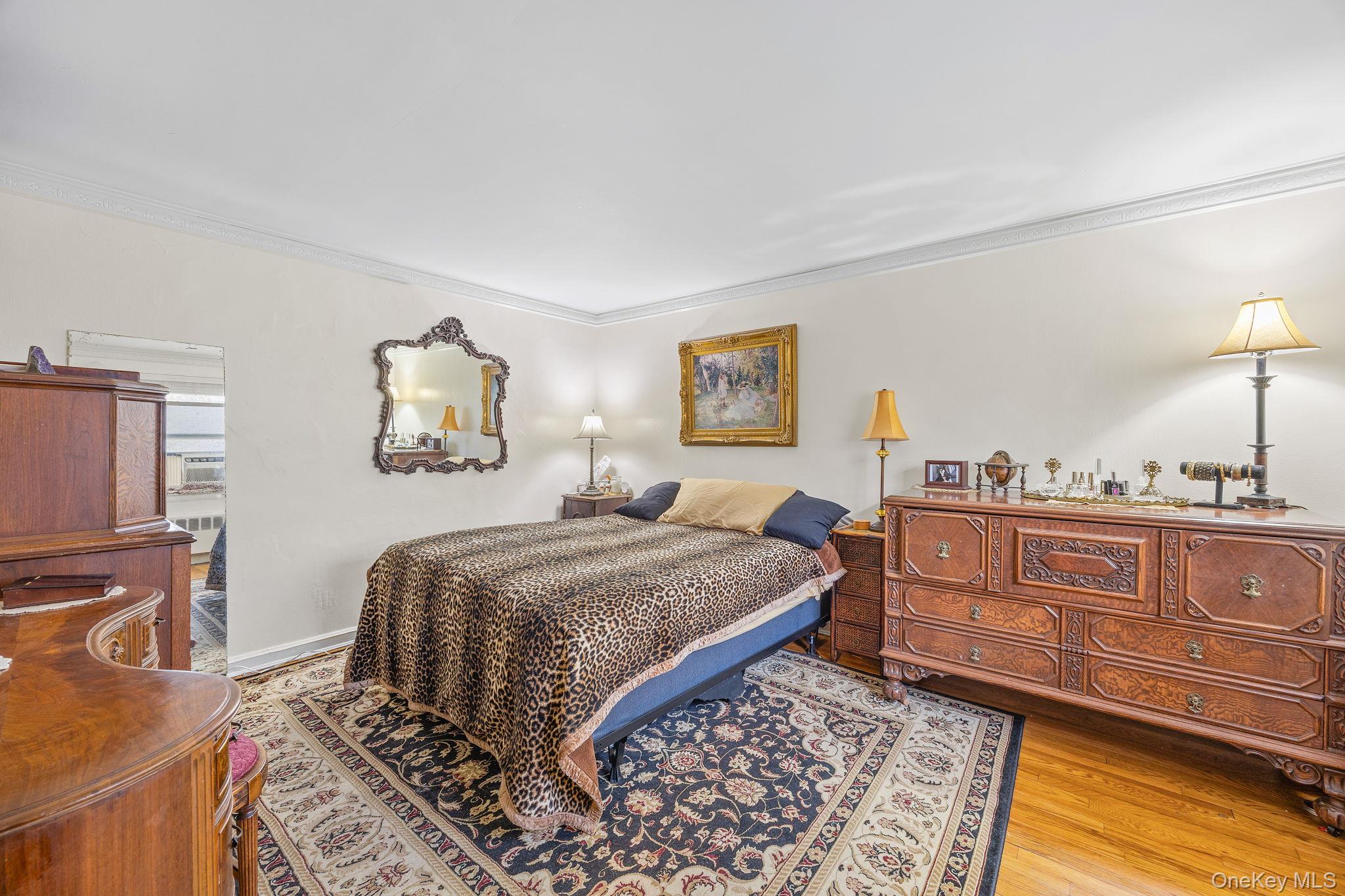 470 Tuckahoe Road, Unit 2A Yonkers, NY 10710 - Photo 8 of 12 a bedroom with a bed and a dresser