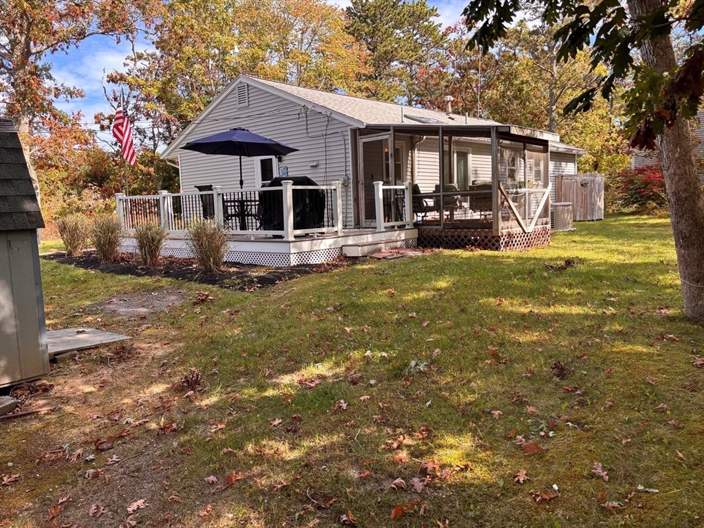 112 Clay Pond Road Bourne, MA 02532 - Photo 30 of 39 a front view of a house with swimming pool garden and patio