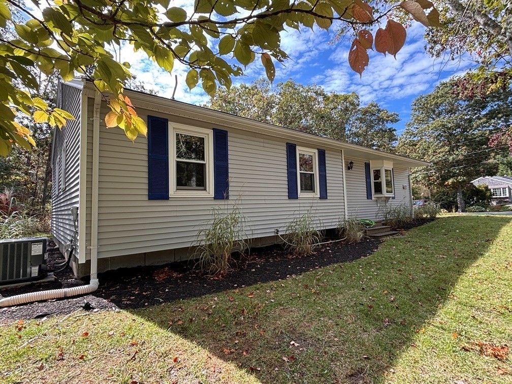 112 Clay Pond Road Bourne, MA 02532 - Photo 35 of 39 a front view of a house with garden