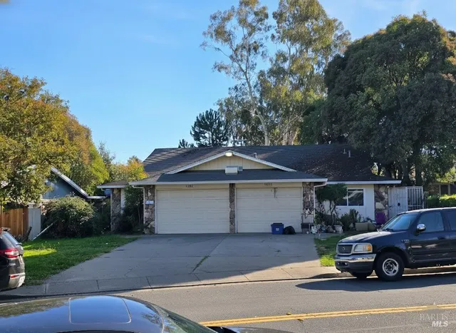 a view of a car parked in front of a house