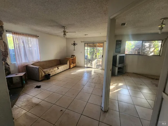 a lobby with furniture and window