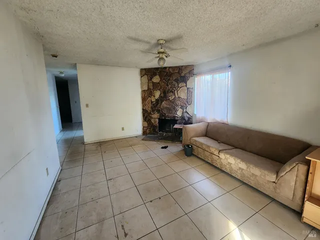 a living room with a couch and a large window