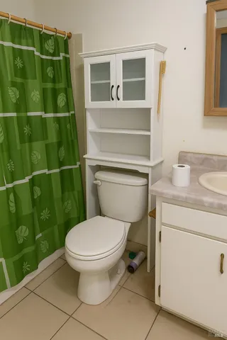 a bathroom with a toilet and a sink