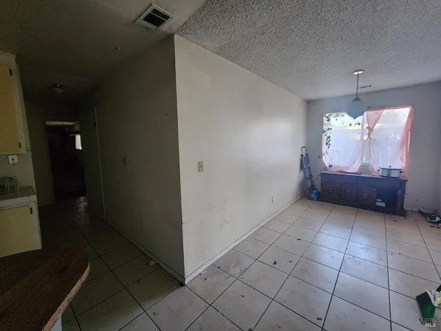 a view of a windows and chandelier in a room