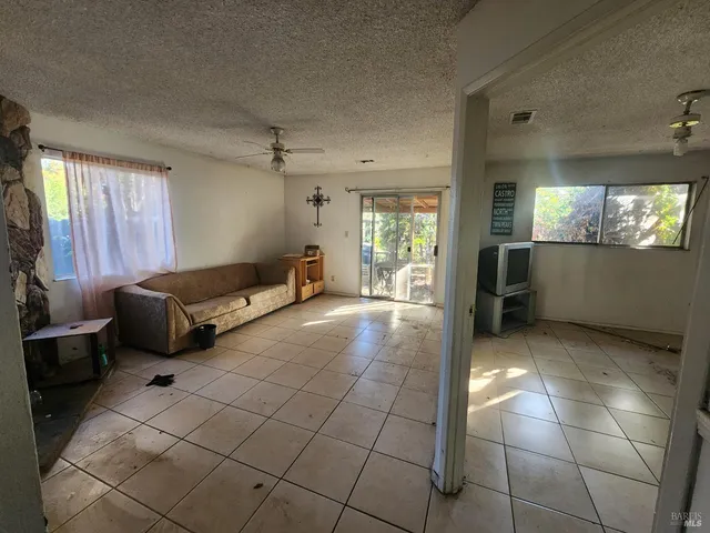 a living room with furniture and windows