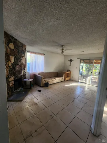 a room with gym equipment and a large window