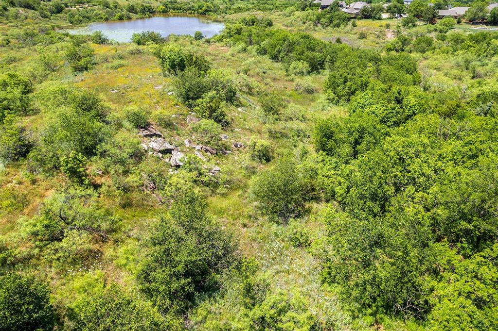 18 Canyon View Court Wichita Falls, TX 76309 - Photo 17 of 17 a view of a big yard with plants and large trees