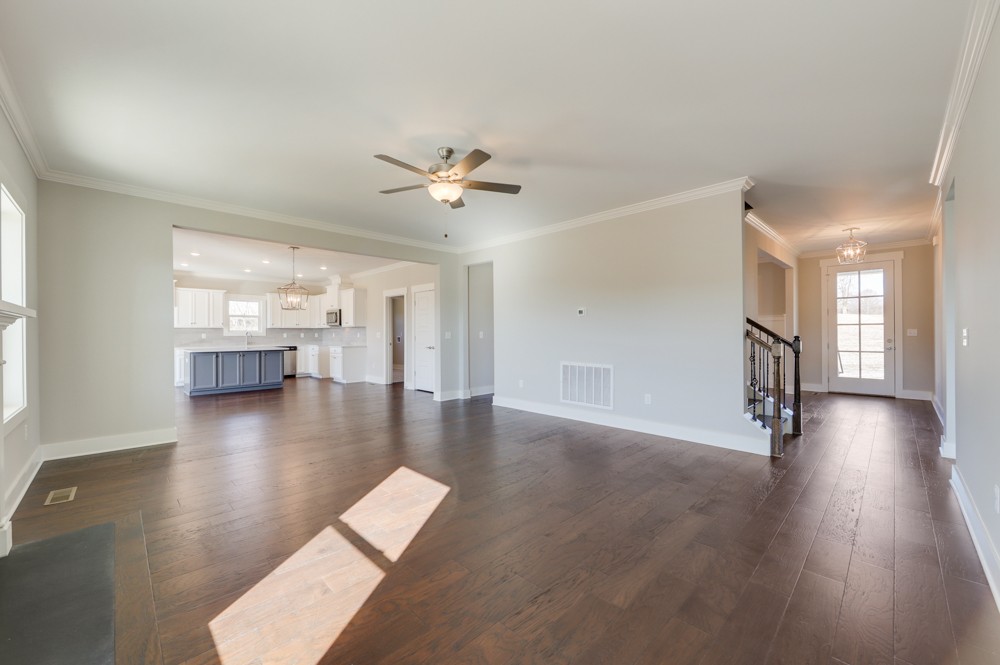 575 Flippen Road Lebanon, TN 37087 - Photo 4 of 14 a view of a livingroom with wooden floor and a kitchen