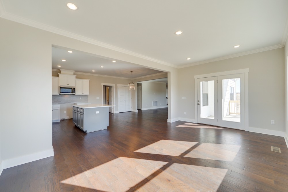 575 Flippen Road Lebanon, TN 37087 - Photo 8 of 14 a view of a living room kitchen and a kitchen with wooden floor