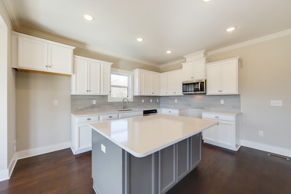 575 Flippen Road Lebanon, TN 37087 - Photo 9 of 14 a kitchen with a sink a stove a refrigerator and white cabinets