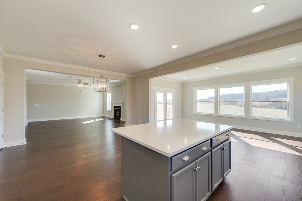 575 Flippen Road Lebanon, TN 37087 - Photo 10 of 14 an open kitchen with a sink and dishwasher with wooden floor